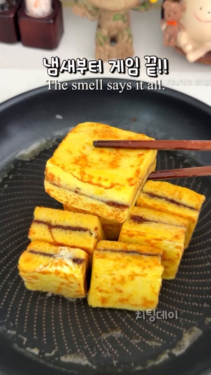 Melt butter in a pan. Cook each bread piece until golden brown on both sides.